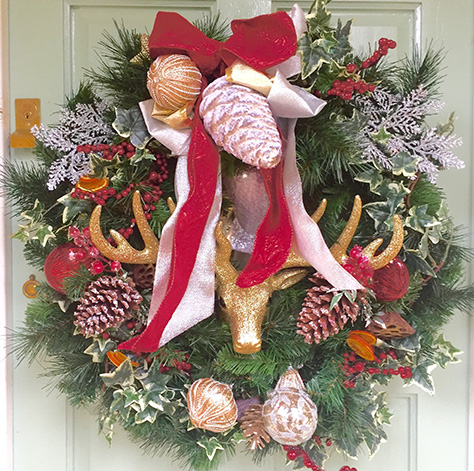 Wreath on a door with Reindeer and Ribbons